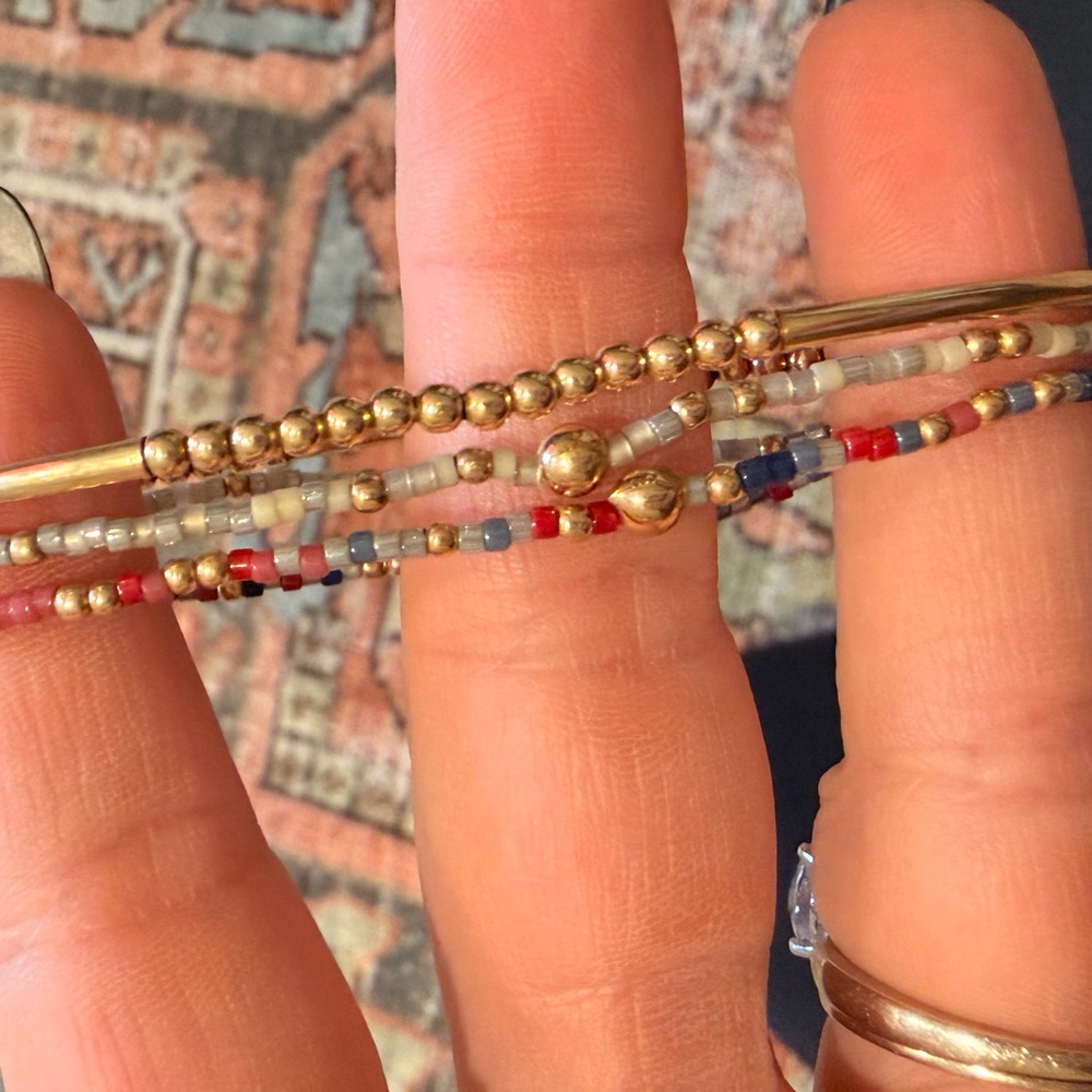 Gold Enewton bracelets